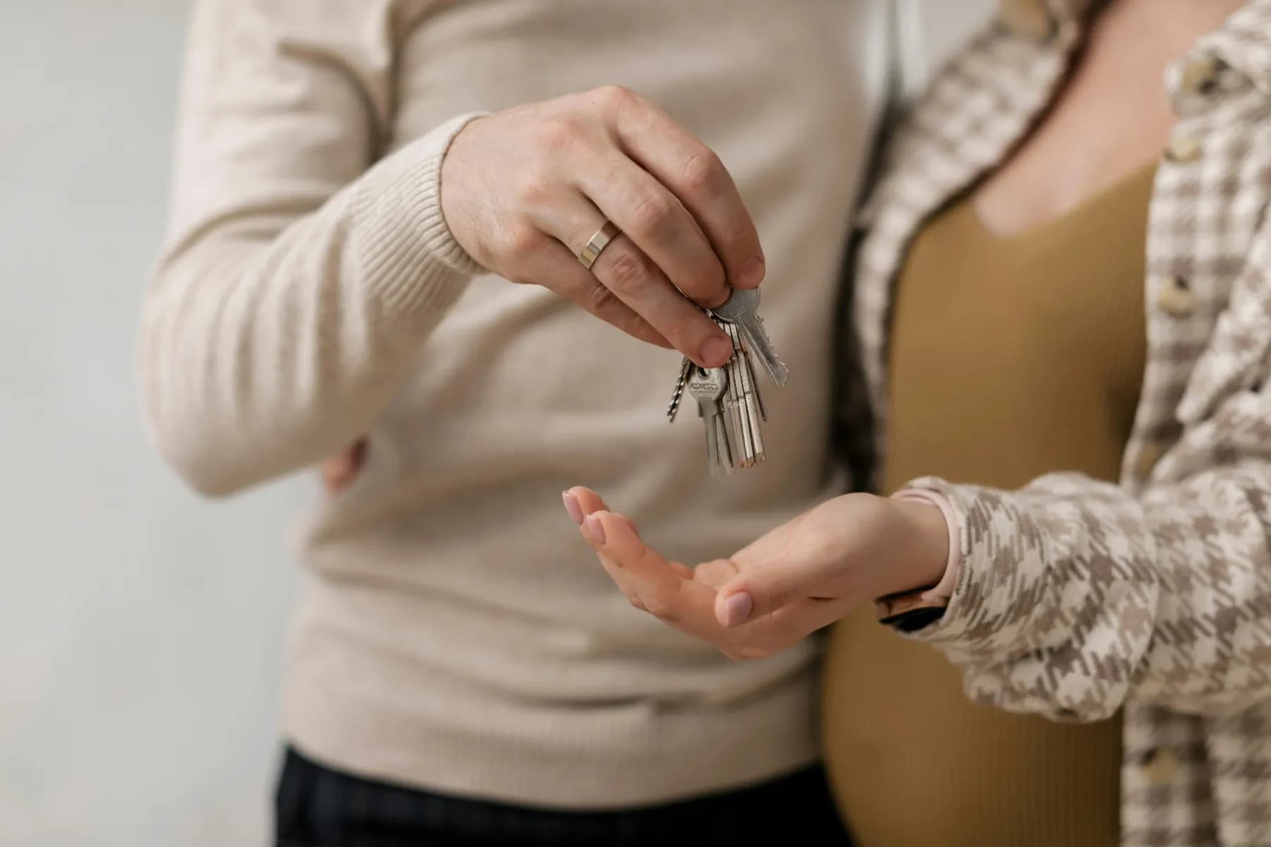 A couple holding the keys to their new home